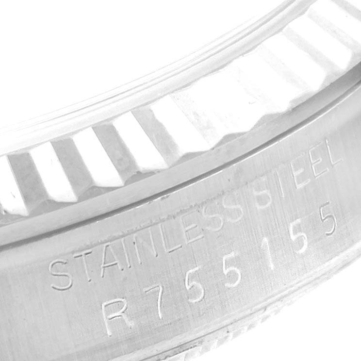This close-up image shows part of the stainless steel caseback with serial number of a Rolex Datejust 16234 Men's Stainless Steel Silver Dial 16234 Men's Stainless Steel Silver Dial watch.