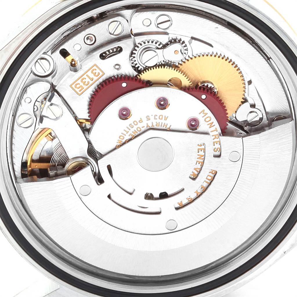 This image shows the intricate movement mechanism of a Rolex Datejust 16233 Men's Steel and Gold (two tone) Mother of Pearl Dial 16233 Men's Steel and Gold (two tone) Mother of Pearl Dial watch from a back or internal angle.