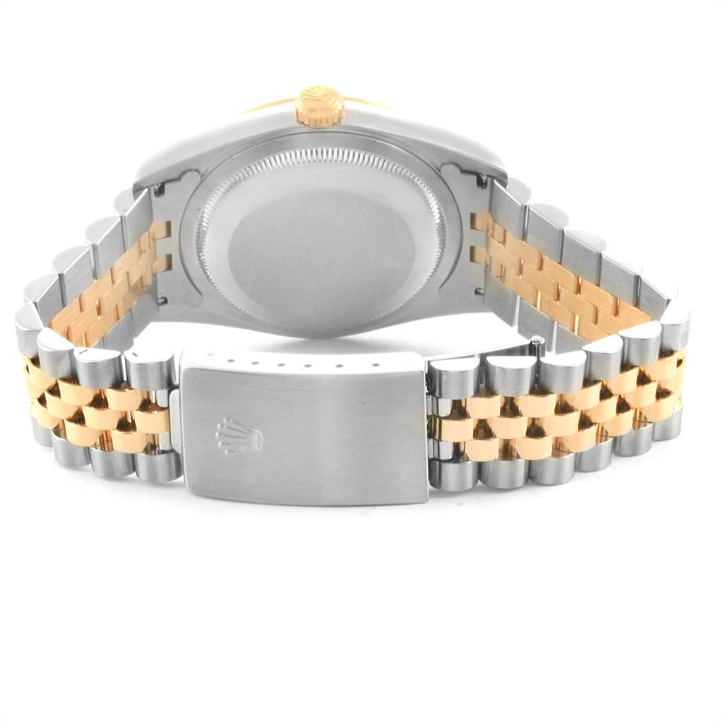 The image shows the back view of a Rolex Datejust 16233 Men's Steel and Gold (two tone) Mother of Pearl Dial 16233 Men's Steel and Gold (two tone) Mother of Pearl Dial watch, featuring its caseback and Jubilee bracelet clasp.