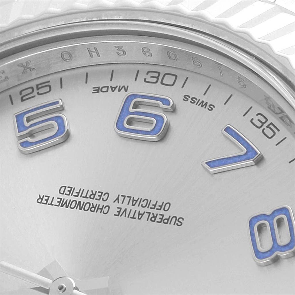 The image shows a close-up of the face of a Rolex Datejust 116334 Men
s Stainless Steel Grey Dial 116334 Men
s Stainless Steel Grey Dial watch, featuring luminescent 5, 6, 7, and 8 markers.