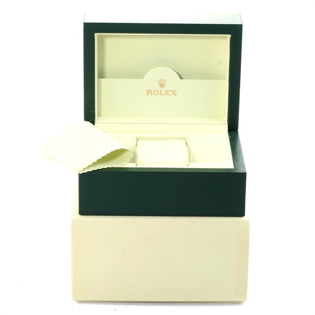 The image shows an open green and cream box for a Rolex Datejust 116231 Men's Steel and Gold (two tone) Pink Dial 116231 Men's Steel and Gold (two tone) Pink Dial watch, revealing a cushion and a cleaning cloth inside.