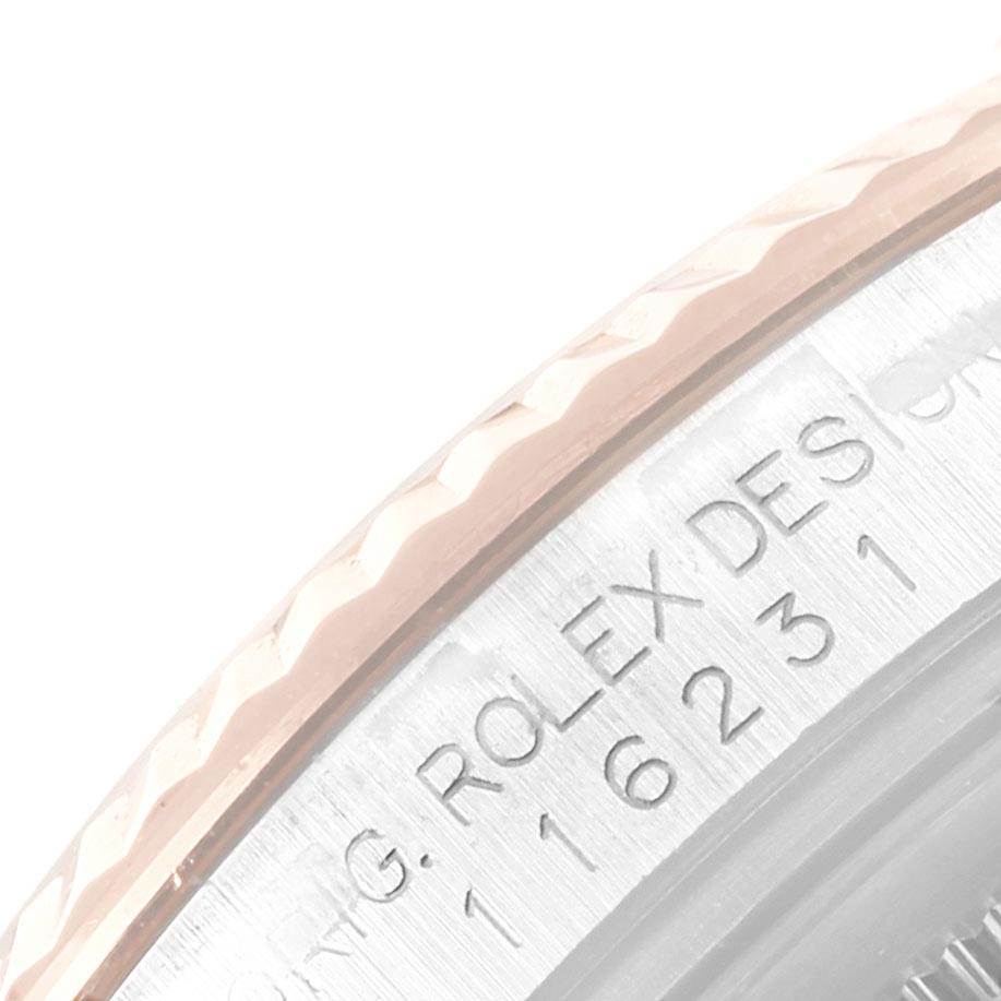 The image shows a close-up of the bezel and serial number engraving on a Rolex Datejust 116231 Men's Steel and Gold (two tone) Pink Dial 116231 Men's Steel and Gold (two tone) Pink Dial watch.