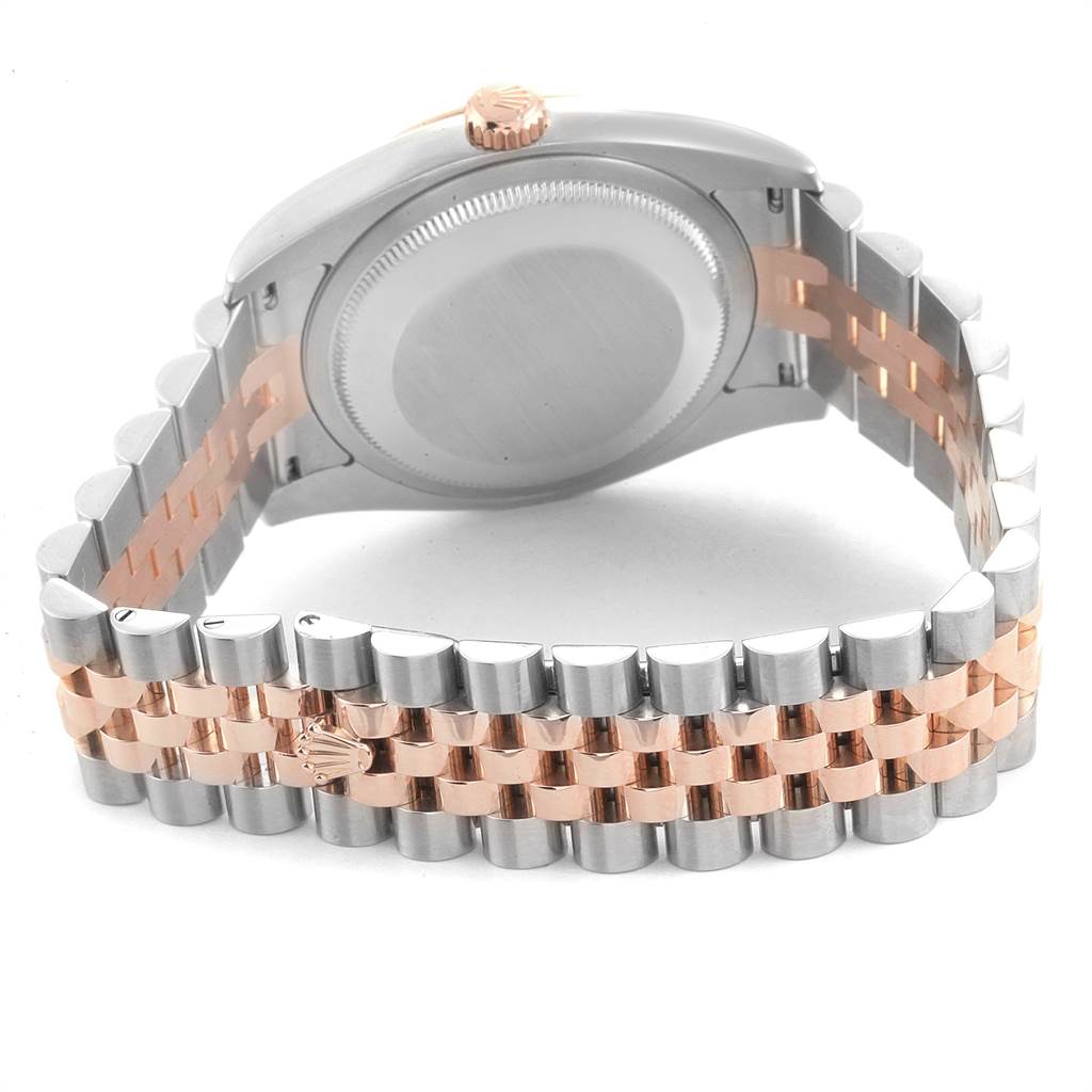 This image shows the back case and bracelet of a Rolex Datejust 116231 Men's Steel and Gold (two tone) Pink Dial 116231 Men's Steel and Gold (two tone) Pink Dial watch, with a silver and rose gold two-tone design.