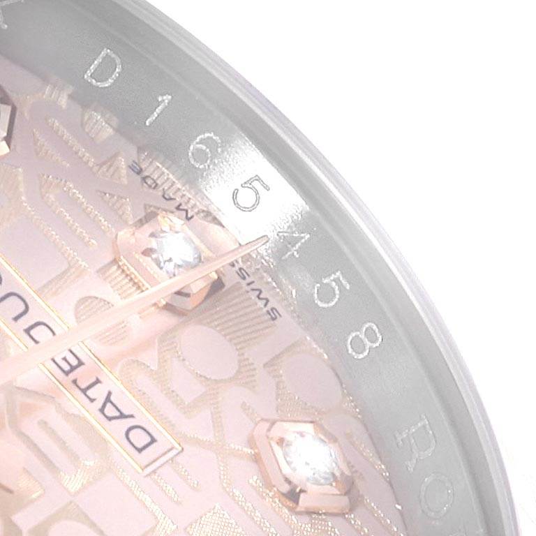 This close-up image shows the dial and part of the chapter ring of a Rolex Datejust 116231 Men's Steel and Gold (two tone) Pink Dial 116231 Men's Steel and Gold (two tone) Pink Dial watch.