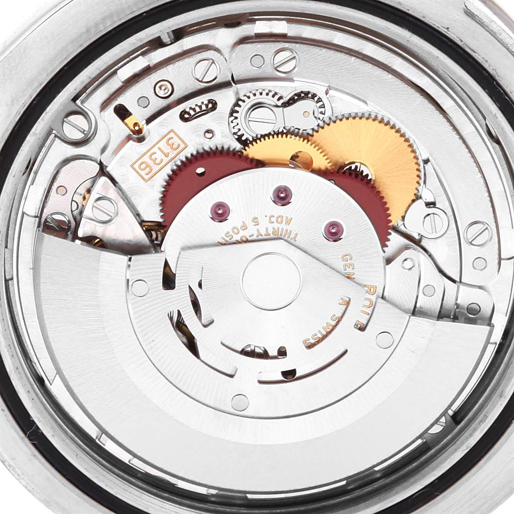 This is an angled view of the movement mechanism of a Rolex Datejust 116334 Men's Stainless Steel Black Dial 116334 Men's Stainless Steel Black Dial model, showing gears and internal components.