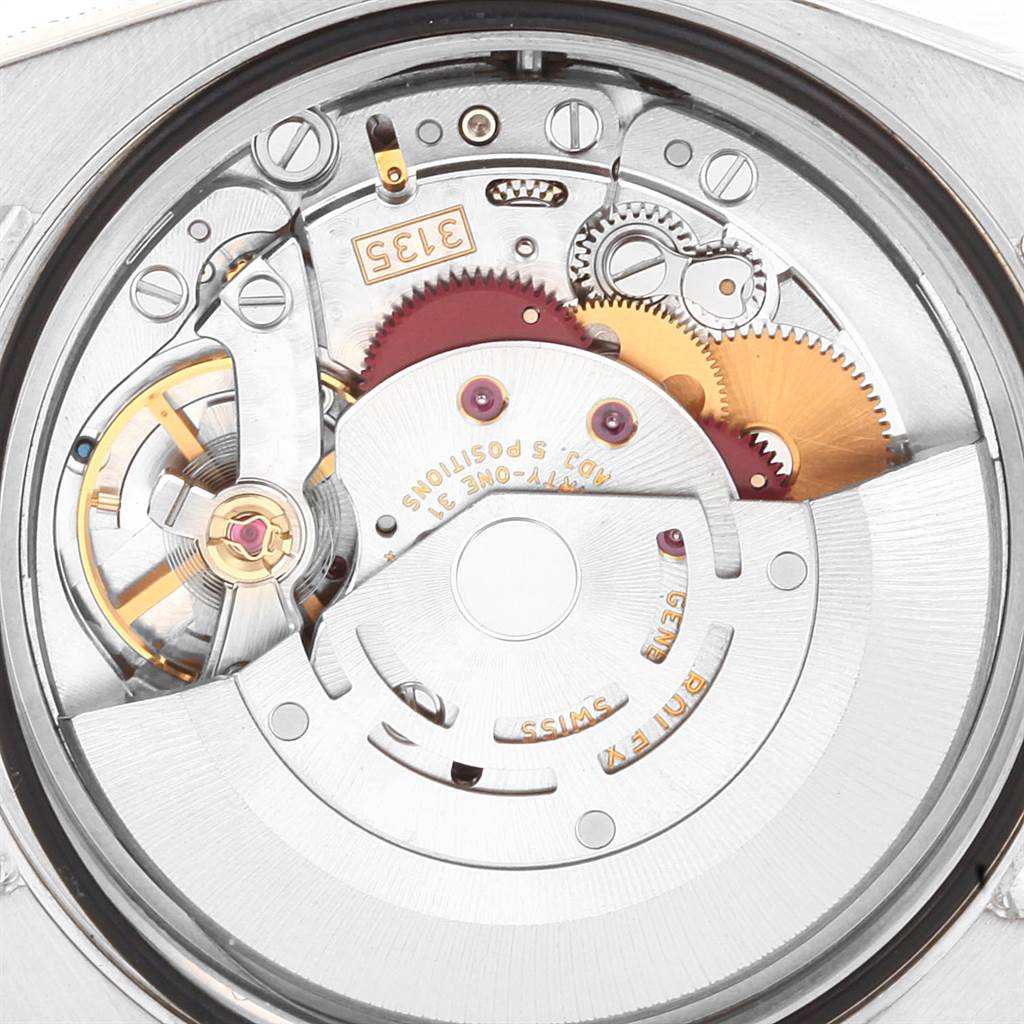 The image shows the inner mechanism, comprising gears and the rotor, of a Rolex Datejust 116234 Men's Stainless Steel Silver Dial 116234 Men's Stainless Steel Silver Dial watch from a close-up angle.