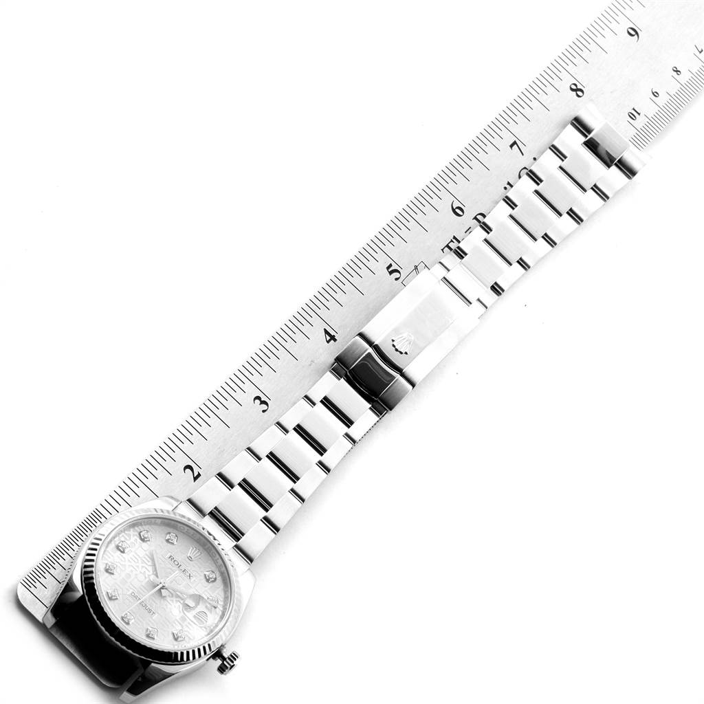 The image shows the Rolex Datejust 116234 Men's Stainless Steel Silver Dial 116234 Men's Stainless Steel Silver Dial watch laid flat next to a ruler, displaying the full bracelet and face.