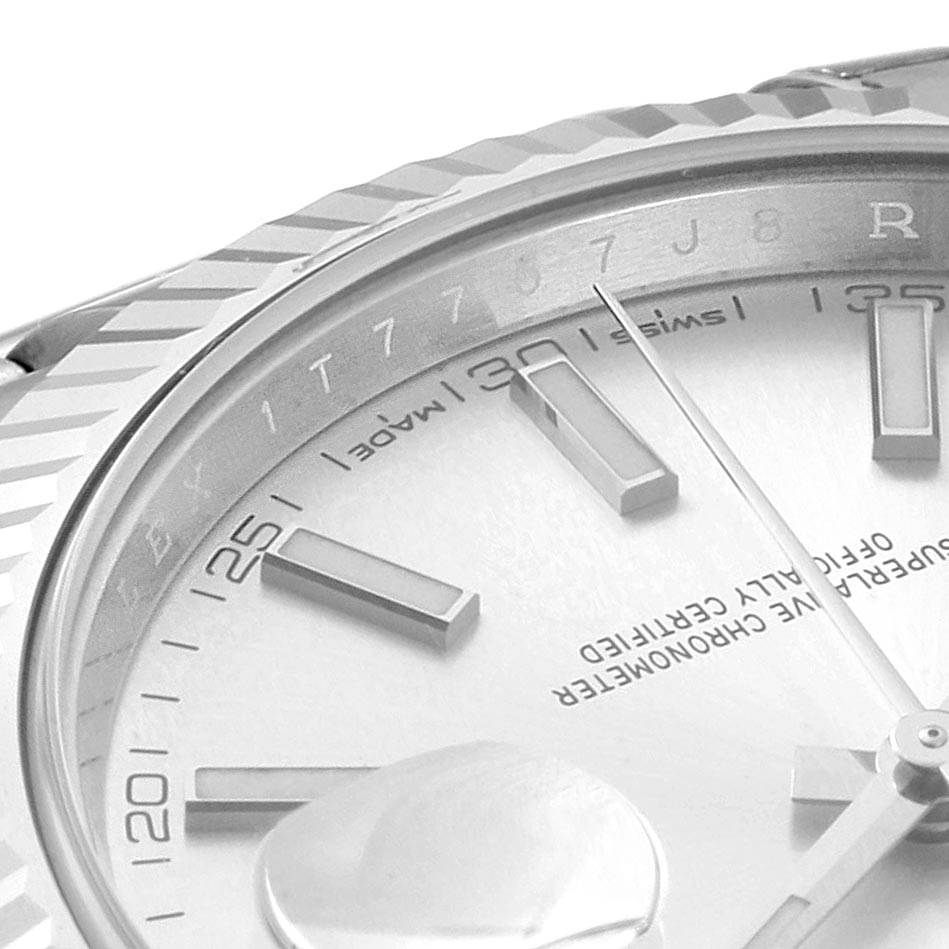 This image shows a close-up of the dial, bezel, and hour markers of a Rolex Datejust 126334 Men
s Stainless Steel Silver Dial 126334 Men
s Stainless Steel Silver Dial watch.
