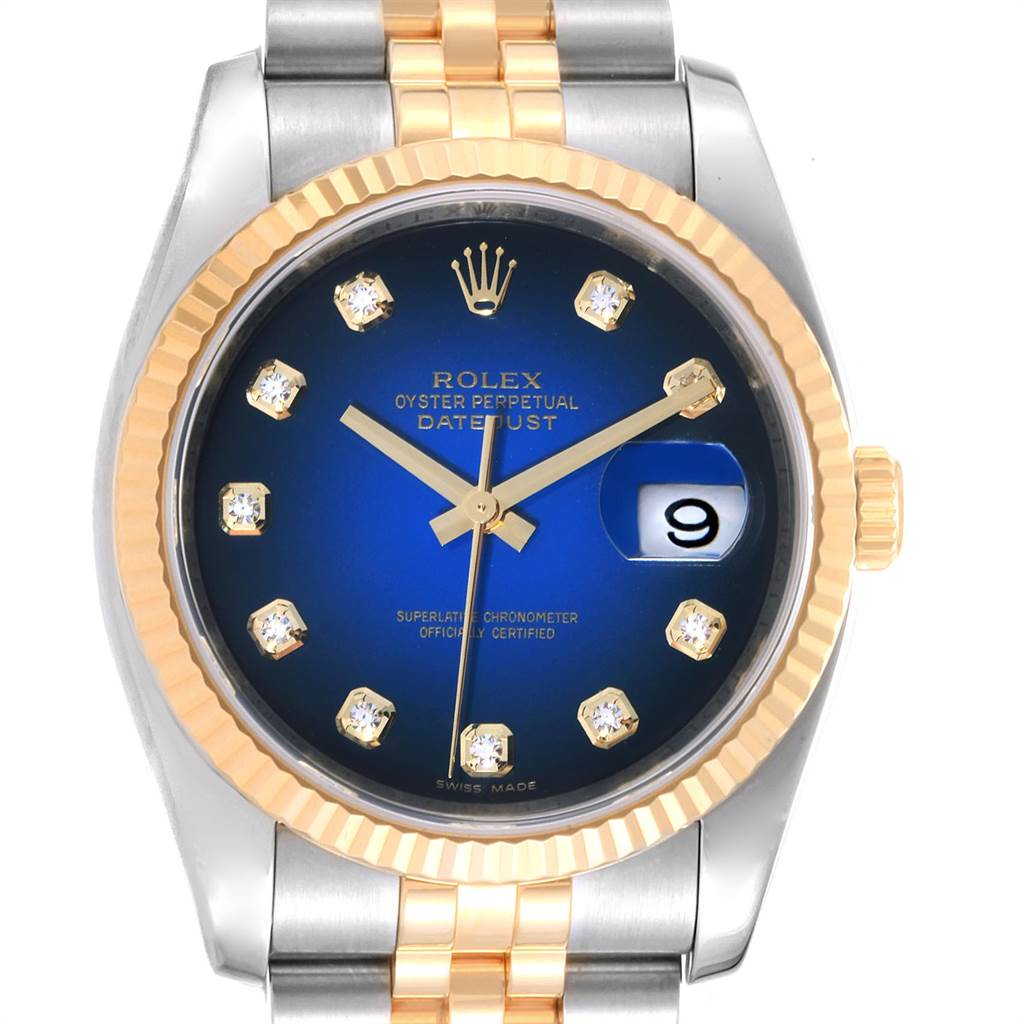 This is a close-up of a Rolex Datejust 116233 Men
s Steel and Gold (two tone) Blue Dial 116233 Men
s Steel and Gold (two tone) Blue Dial watch showing the dial, hands, bezel, date, and part of the bracelet.