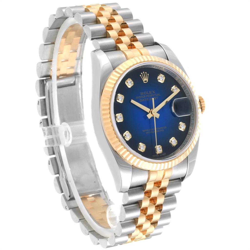 The Rolex Datejust 116233 Men
s Steel and Gold (two tone) Blue Dial 116233 Men
s Steel and Gold (two tone) Blue Dial watch is shown at a three-quarter angle, displaying the dial, bezel, crown, and bracelet.