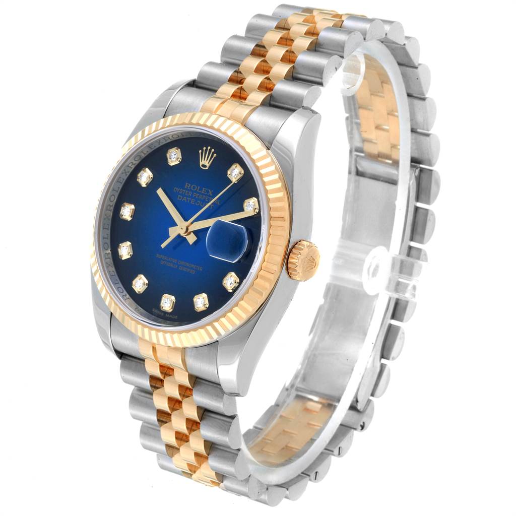 The image shows a Rolex Datejust 116233 Men
s Steel and Gold (two tone) Blue Dial 116233 Men
s Steel and Gold (two tone) Blue Dial watch at a three-quarter angle, highlighting its blue dial, fluted gold bezel, and two-tone bracelet.