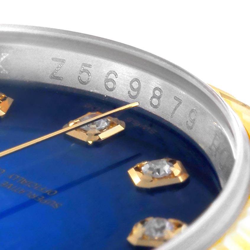 This image shows a close-up of part of the dial and serial number of a Rolex Datejust 116233 Men
s Steel and Gold (two tone) Blue Dial 116233 Men
s Steel and Gold (two tone) Blue Dial watch.