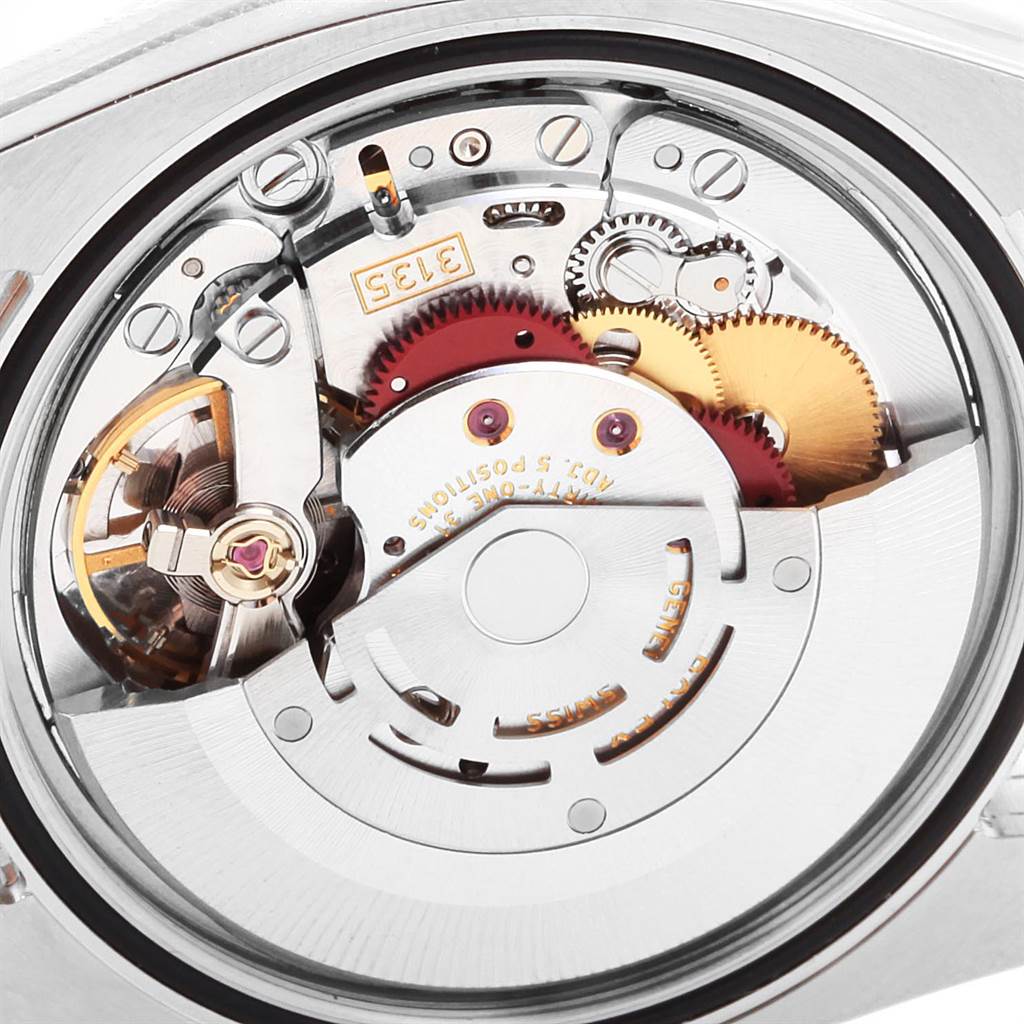 The image shows the movement close-up view of the Rolex Datejust 116233 Men
s Steel and Gold (two tone) Blue Dial 116233 Men
s Steel and Gold (two tone) Blue Dial watch, highlighting the intricate gears and mechanics.