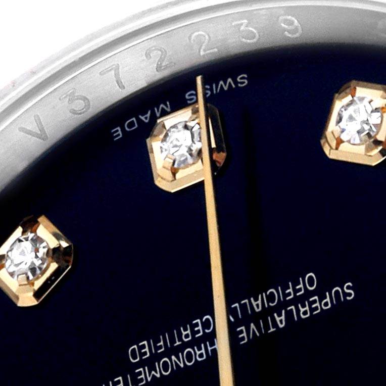 The image shows a close-up of the dial and some markers of the Rolex Datejust 116233 Men's Stainless Steel Black Dial 116233 Men's Stainless Steel Black Dial watch, highlighting diamonds and part of the serial number.
