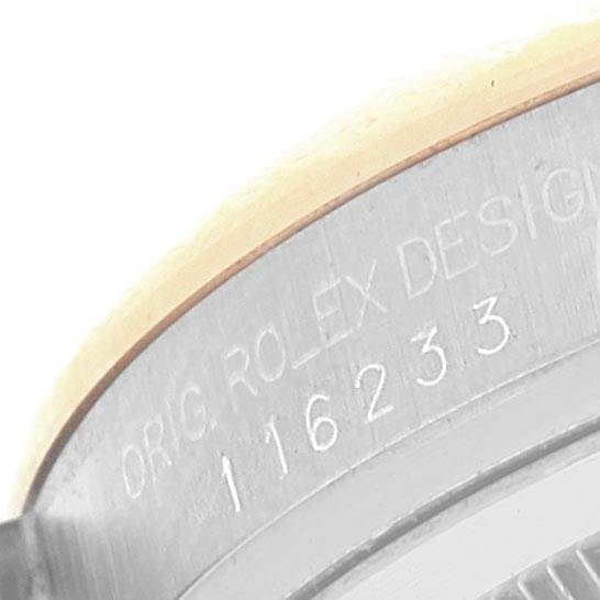 The image shows a close-up of the model number engraving on the casing of a Rolex Datejust 116233 Men's Stainless Steel Champagne Dial 116233 Men's Stainless Steel Champagne Dial.