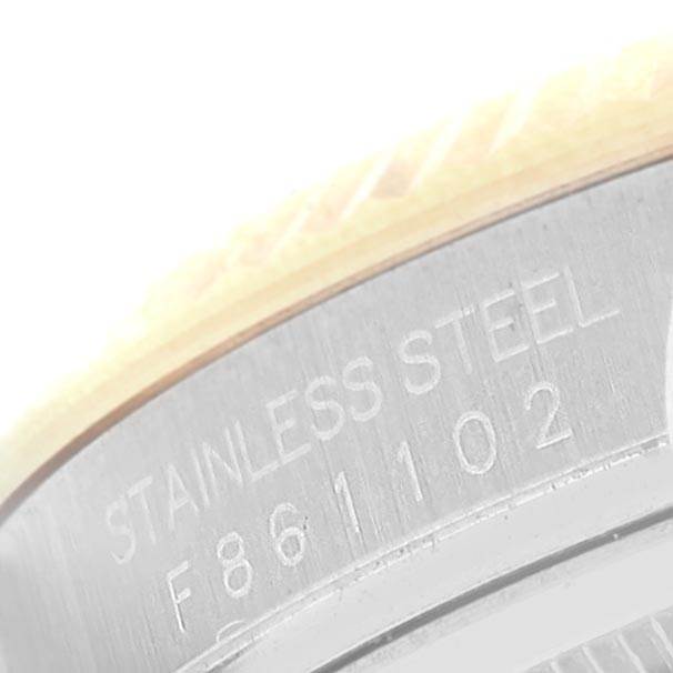 The image shows a close-up of the side of the stainless steel case of a Rolex Datejust 116233 Men's Stainless Steel Champagne Dial 116233 Men's Stainless Steel Champagne Dial watch.