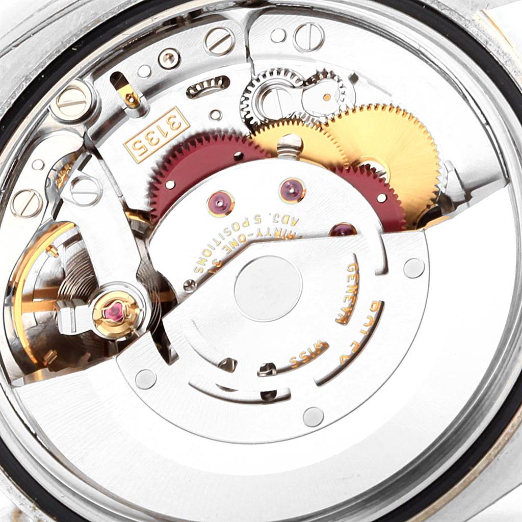This image shows the movement and intricate internal gears of a Rolex Datejust 116233 Men's Stainless Steel Champagne Dial 116233 Men's Stainless Steel Champagne Dial watch.