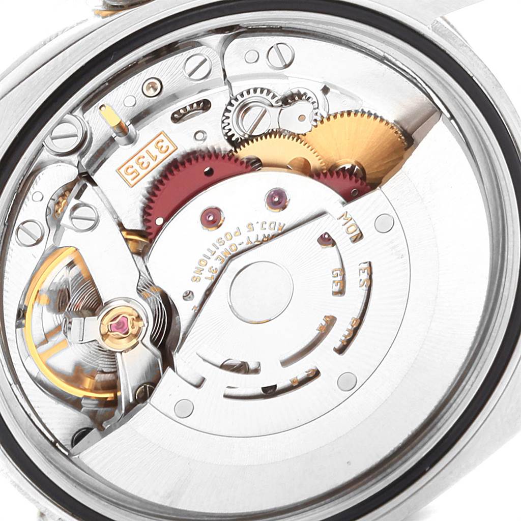This image shows a close-up of the internal mechanism and gears of a Rolex Datejust 116233 Men's Stainless Steel Champagne Dial 116233 Men's Stainless Steel Champagne Dial watch.