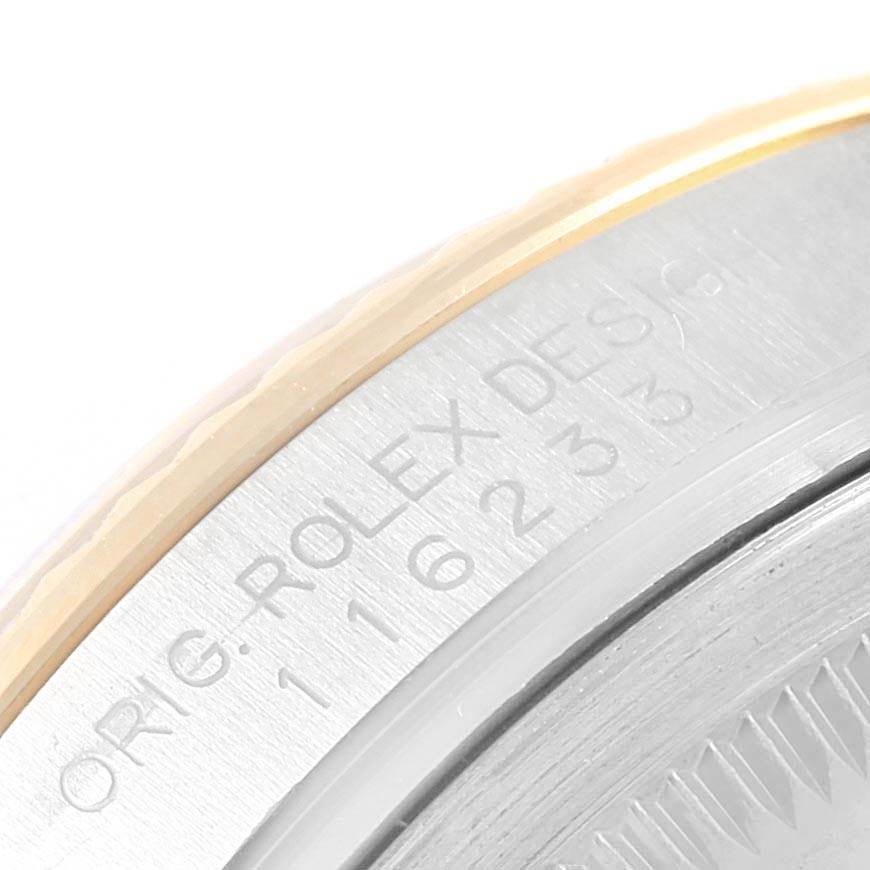 The image shows the side engraving and partial bezel of a Rolex Datejust 116233 Men's Stainless Steel Champagne Dial 116233 Men's Stainless Steel Champagne Dial model.