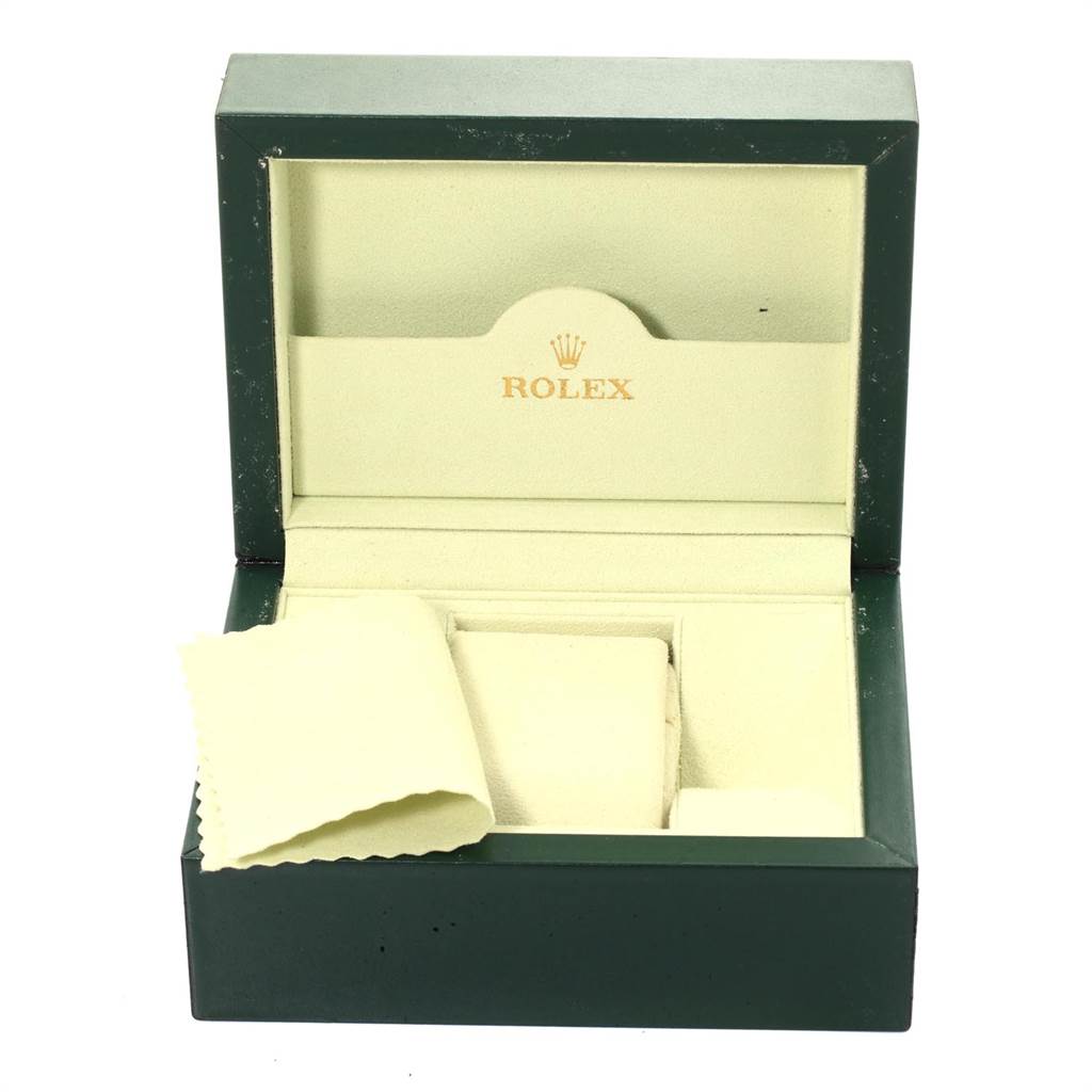This image shows an open green Rolex Datejust 116233 Men's Stainless Steel Champagne Dial 116233 Men's Stainless Steel Champagne Dial watch box and polishing cloth.