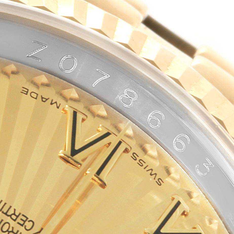 The image shows a close-up of a Rolex Datejust 116233 Men's Stainless Steel Champagne Dial 116233 Men's Stainless Steel Champagne Dial watch, revealing part of the bezel, dial, and serial number.