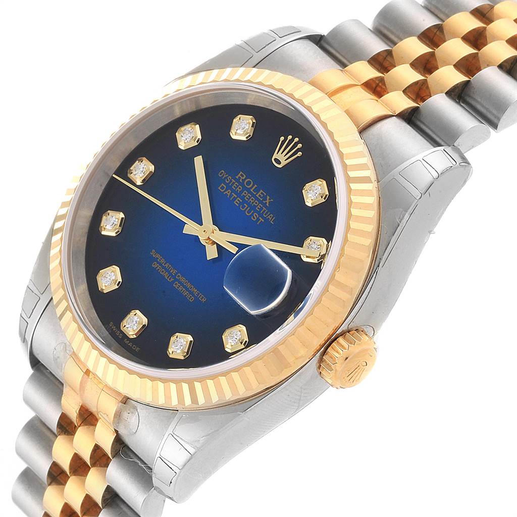 The image shows a close-up of a Rolex Datejust 116233 Men's Stainless Steel Blue Dial 116233 Men's Stainless Steel Blue Dial watch at a slight angle, highlighting its blue dial, diamond markers, two-tone bezel, and jubilee bracelet.