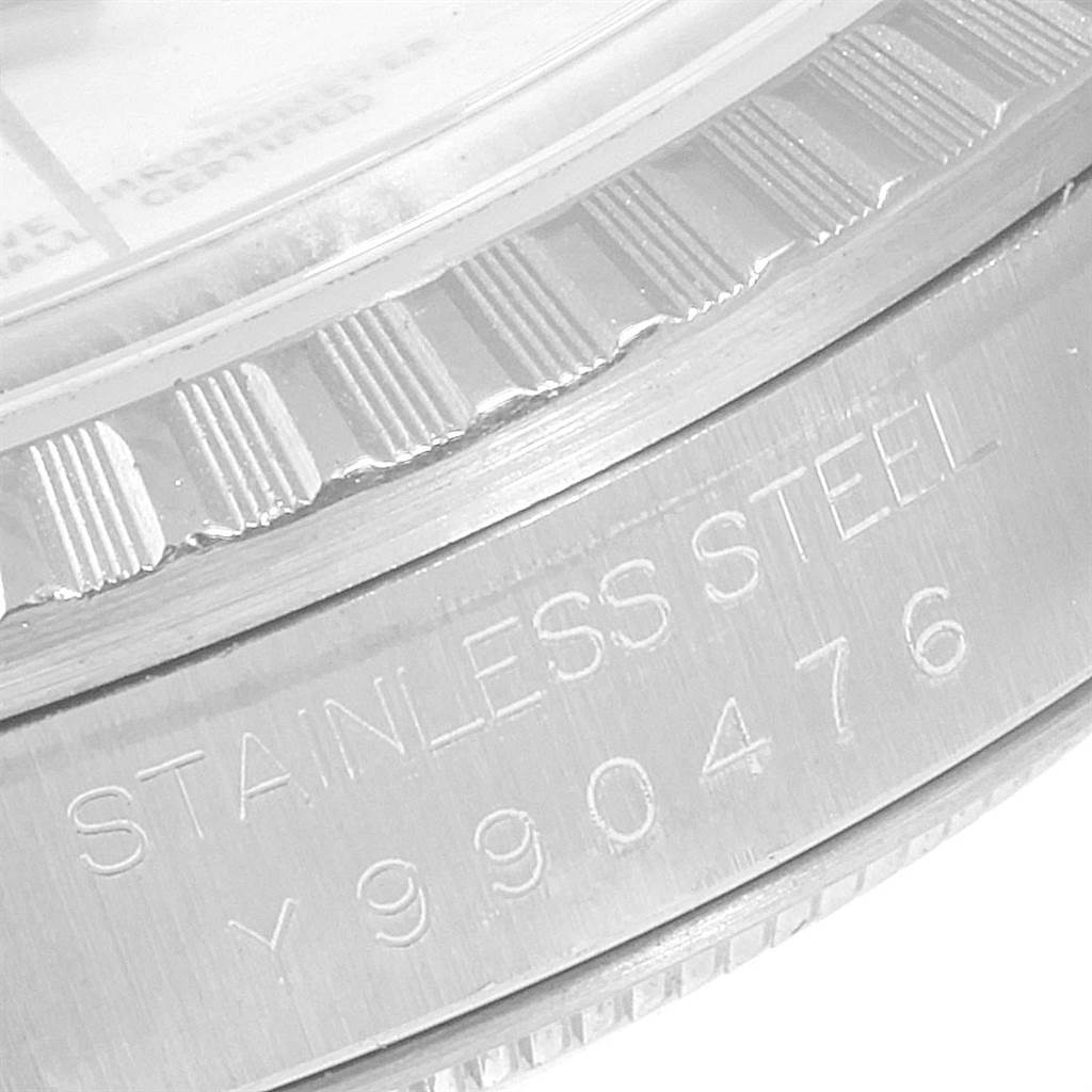 The image shows a close-up of the bezel and the case edge with the serial number engraving of a Rolex Datejust 16220 Men's Stainless Steel White Dial 16220 Men's Stainless Steel White Dial watch.