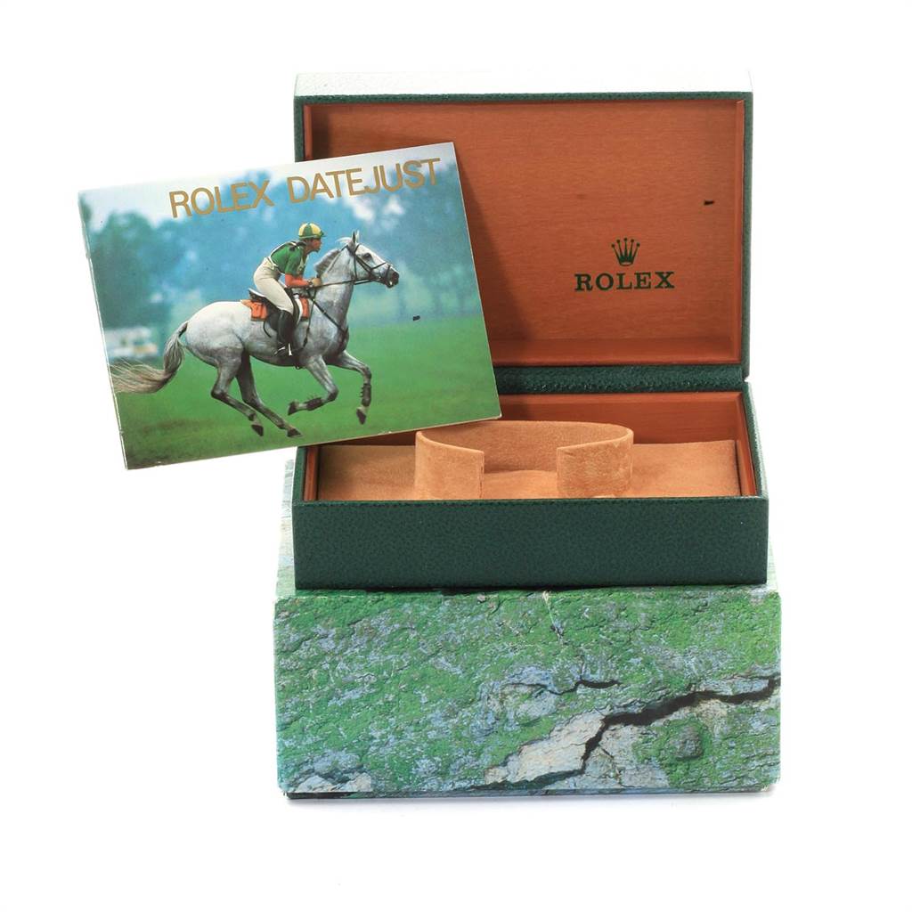 The image shows an open Rolex Datejust 16220 Men's Stainless Steel White Dial 16220 Men's Stainless Steel White Dial watch box with its manual displayed in front.