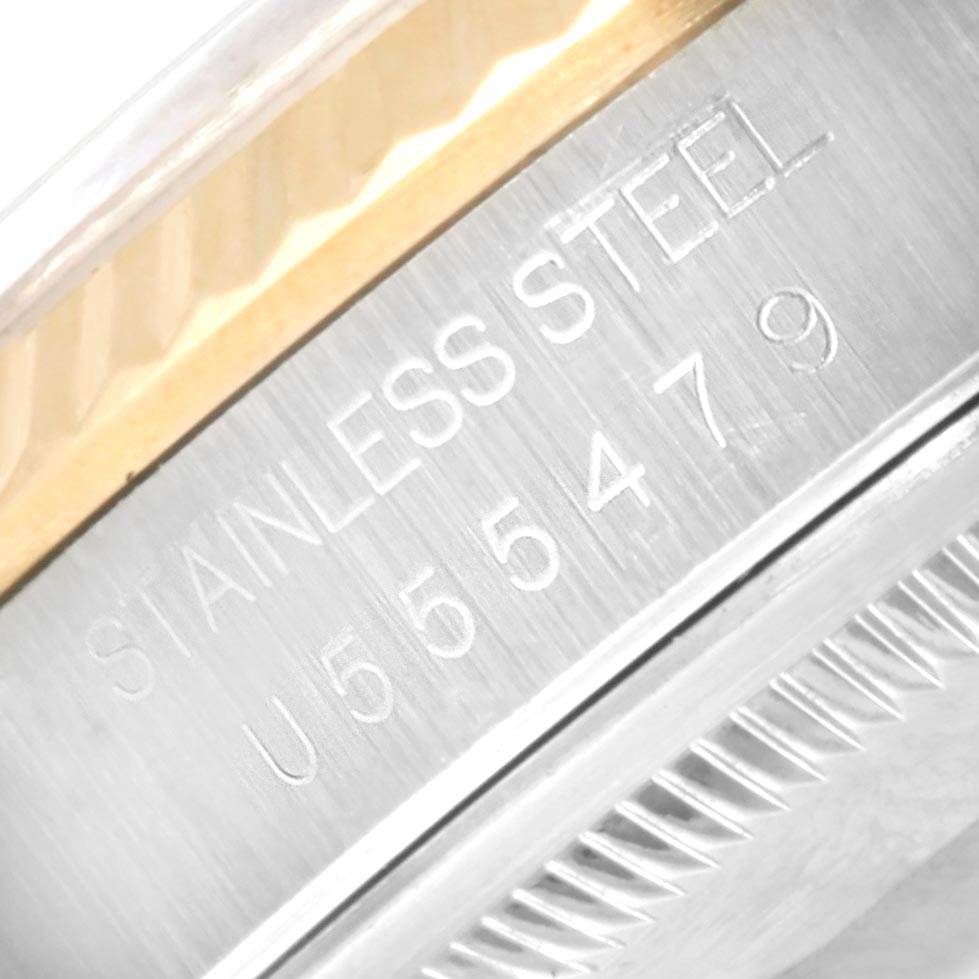 The image shows a macro shot of the case side of a Rolex Datejust 16233 Men's Steel and Gold (two tone) Champagne Dial 16233 Men's Steel and Gold (two tone) Champagne Dial watch, focusing on the "STAINLESS STEEL" engraving.