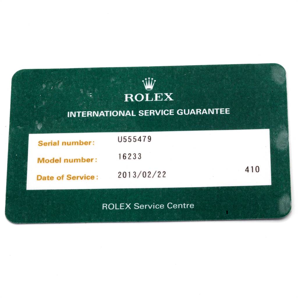 This image shows a Rolex Datejust 16233 Men's Steel and Gold (two tone) Champagne Dial 16233 Men's Steel and Gold (two tone) Champagne Dial International Service Guarantee card displaying the serial number, model number, and date of service.