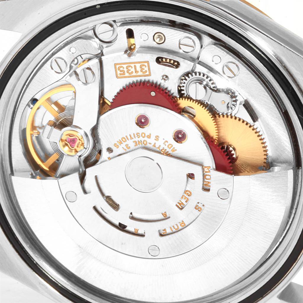 This image shows the intricate internal mechanism of a Rolex Datejust 16233 Men's Steel and Gold (two tone) Champagne Dial 16233 Men's Steel and Gold (two tone) Champagne Dial model watch viewed from the back.