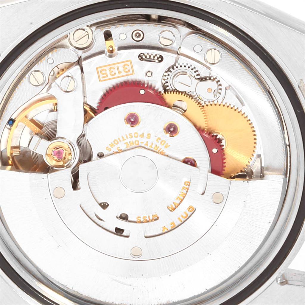 This image shows the detailed inner mechanism of a Rolex Datejust 116233 Men's Stainless Steel Beige Dial 116233 Men's Stainless Steel Beige Dial model watch from a close-up angle.