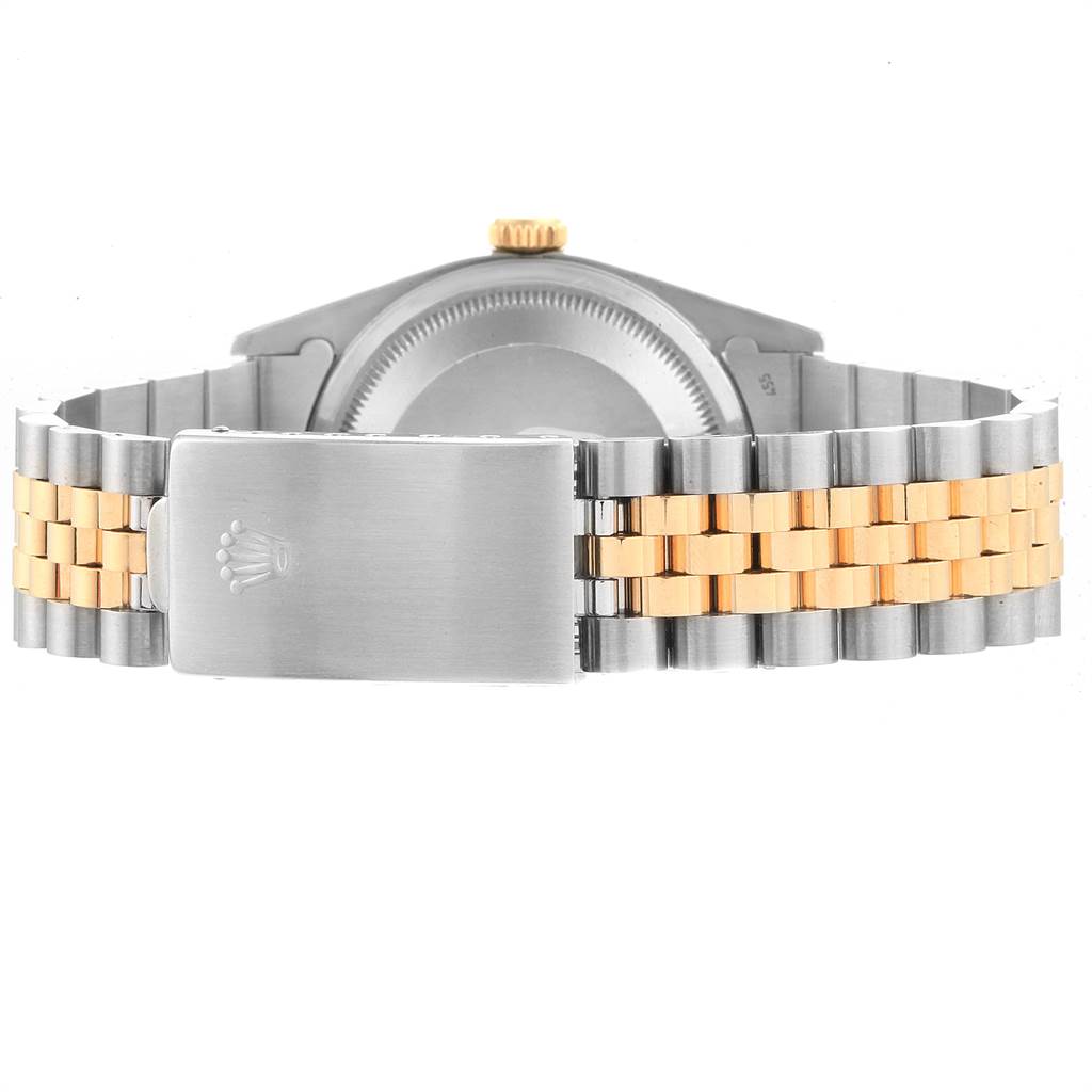 This Rolex Datejust 16233 Men
s Steel and Gold (two tone) Black Dial 16233 Men
s Steel and Gold (two tone) Black Dial model watch is shown from the back, highlighting its bicolor bracelet and clasp.