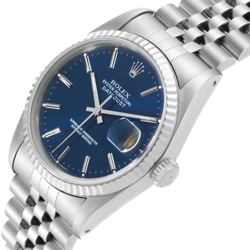 The image shows a side-angle view of a Rolex Datejust 16234 Men's Stainless Steel Blue Dial 16234 Men's Stainless Steel Blue Dial watch, highlighting its blue dial, date window, and stainless steel bracelet.