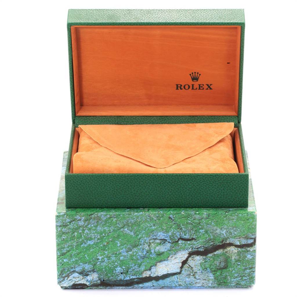 The image shows an open green Rolex box containing an orange suede pouch, likely an accessory for a Rolex Datejust 16234 Men's Stainless Steel Blue Dial 16234 Men's Stainless Steel Blue Dial watch.