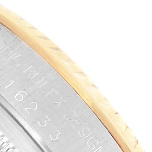 This image shows a close-up angle of the engraved side of the bezel on a Rolex Datejust 16233 Men's Steel and Gold (two tone) Silver Dial 16233 Men's Steel and Gold (two tone) Silver Dial watch.