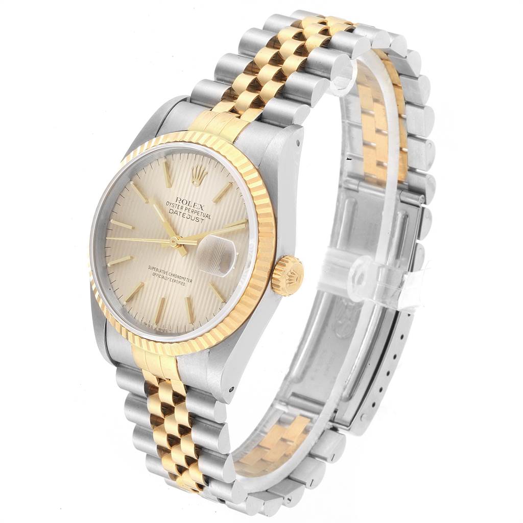 The image shows a Rolex Datejust 16233 Men's Steel and Gold (two tone) Silver Dial 16233 Men's Steel and Gold (two tone) Silver Dial watch at an angled side view, highlighting its two-tone bracelet, bezel, and dial.