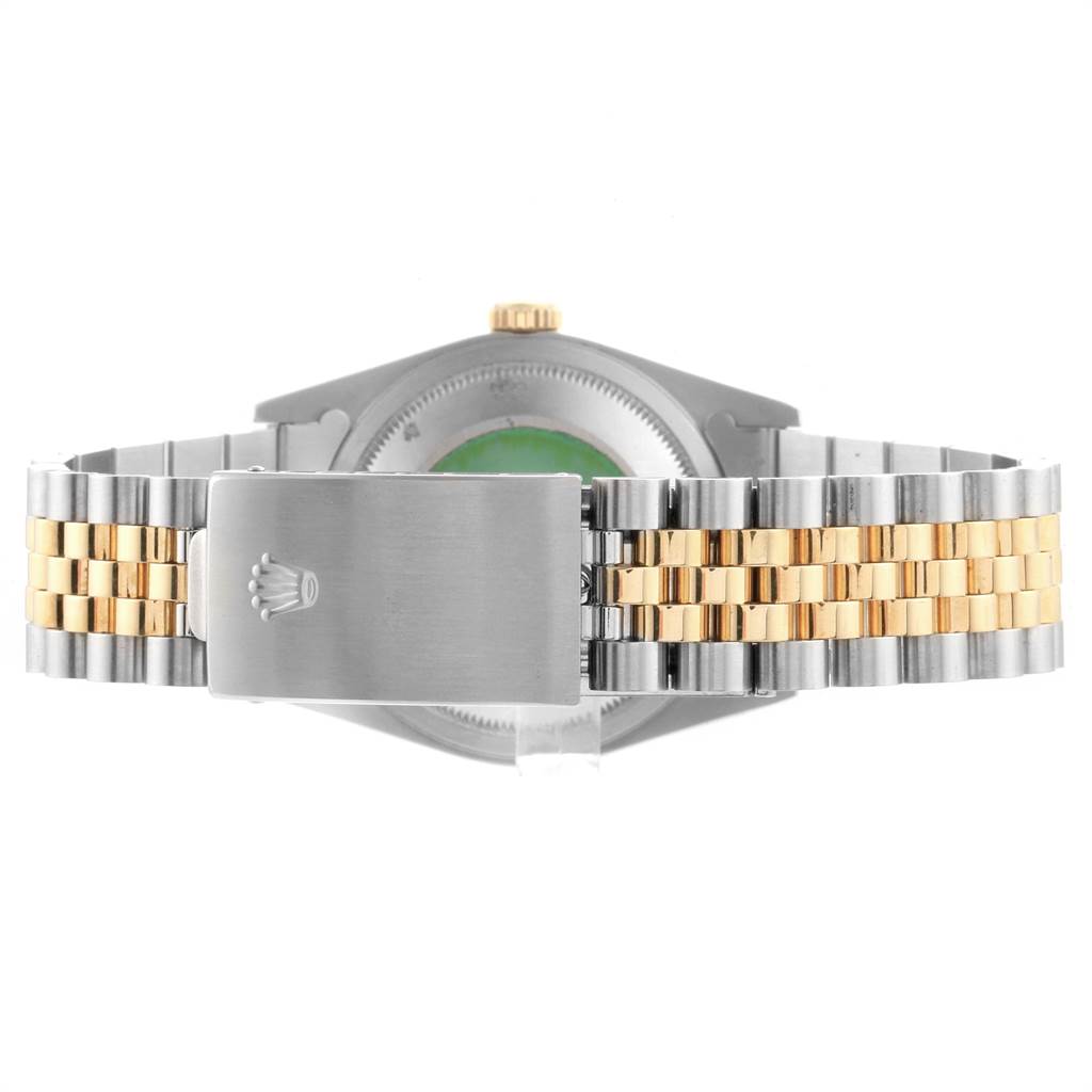 This image showcases the back view of a Rolex Datejust 16233 Men's Steel and Gold (two tone) Silver Dial 16233 Men's Steel and Gold (two tone) Silver Dial watch, highlighting its two-tone bracelet and clasp.