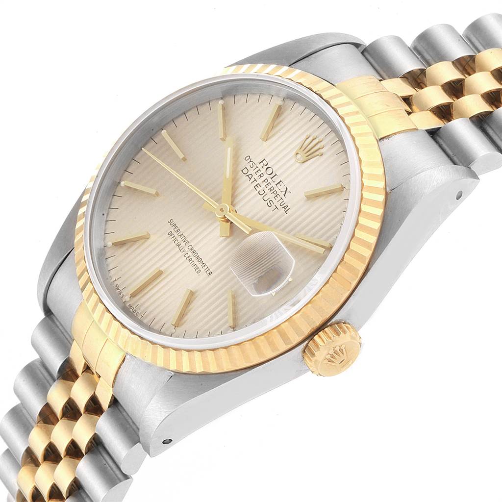 This Rolex Datejust 16233 Men's Steel and Gold (two tone) Silver Dial 16233 Men's Steel and Gold (two tone) Silver Dial watch is shown at an angle highlighting the face, bezel, crown, and part of the bracelet.