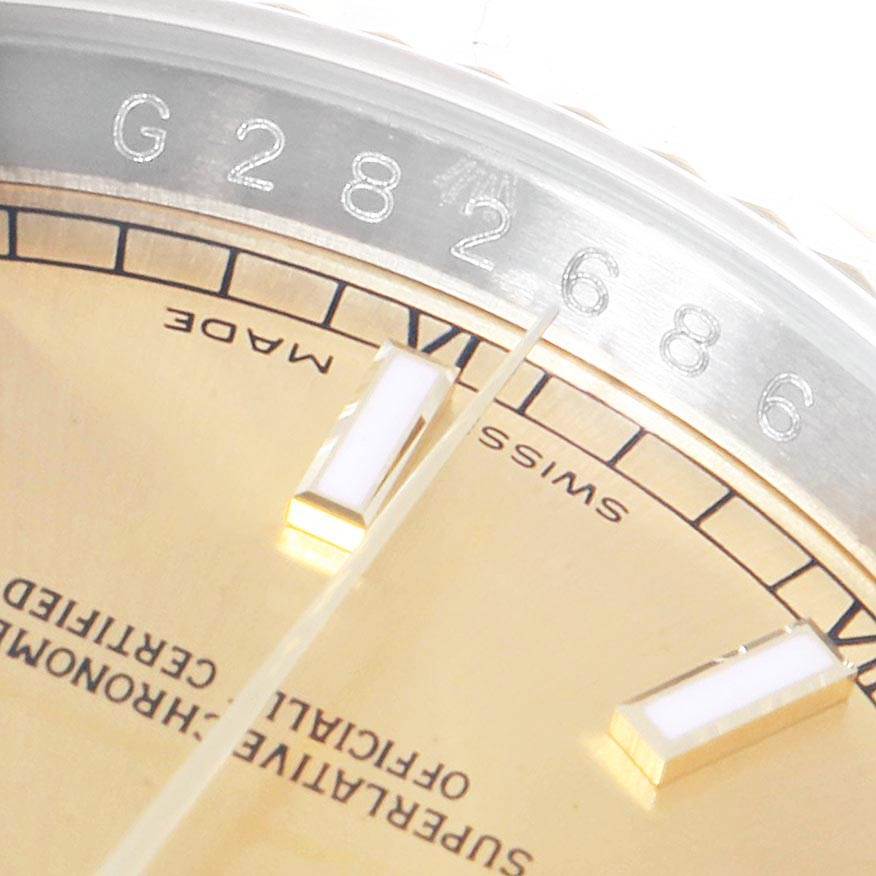 This image shows a close-up angle of the Rolex Datejust 116233 Men's Stainless Steel Champagne Dial 116233 Men's Stainless Steel Champagne Dial watch face, highlighting part of the bezel and dial.