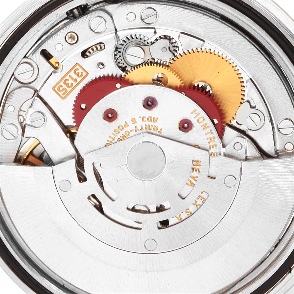 This image shows a close-up view of the internal movement mechanism of a Rolex Datejust 16234 Men's Stainless Steel White Dial 16234 Men's Stainless Steel White Dial watch, highlighting its gears and components.
