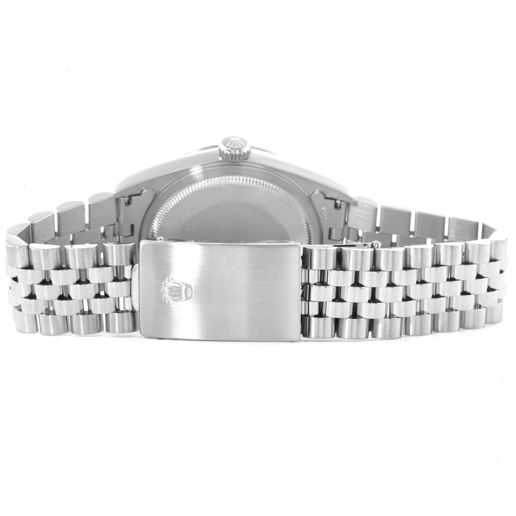 The image shows the back and clasp of a Rolex Datejust 16220 Men's Stainless Steel White Dial 16220 Men's Stainless Steel White Dial watch, highlighting its bracelet and crown logo.