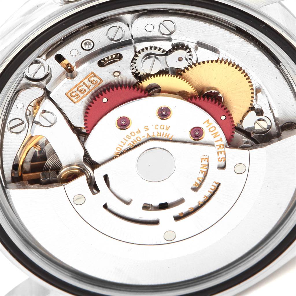 This image shows the inner mechanical movement parts of the Rolex Datejust 16220 Men's Stainless Steel White Dial 16220 Men's Stainless Steel White Dial watch, including gears and wheels, viewed from the back.