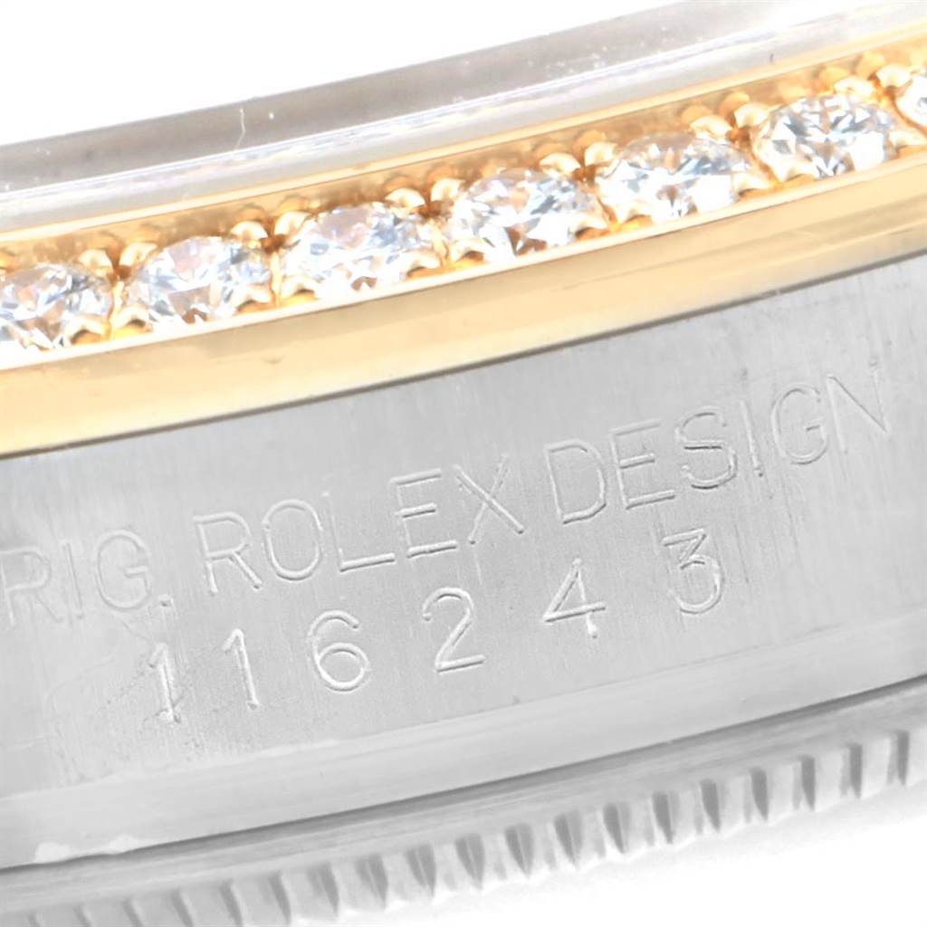 Close-up view of a portion of the bezel and case side of a Rolex Datejust 116243 Women's Steel and Gold (two tone) Brown Dial 116243 Women's Steel and Gold (two tone) Brown Dial, showcasing diamond accents and the model number engraving.