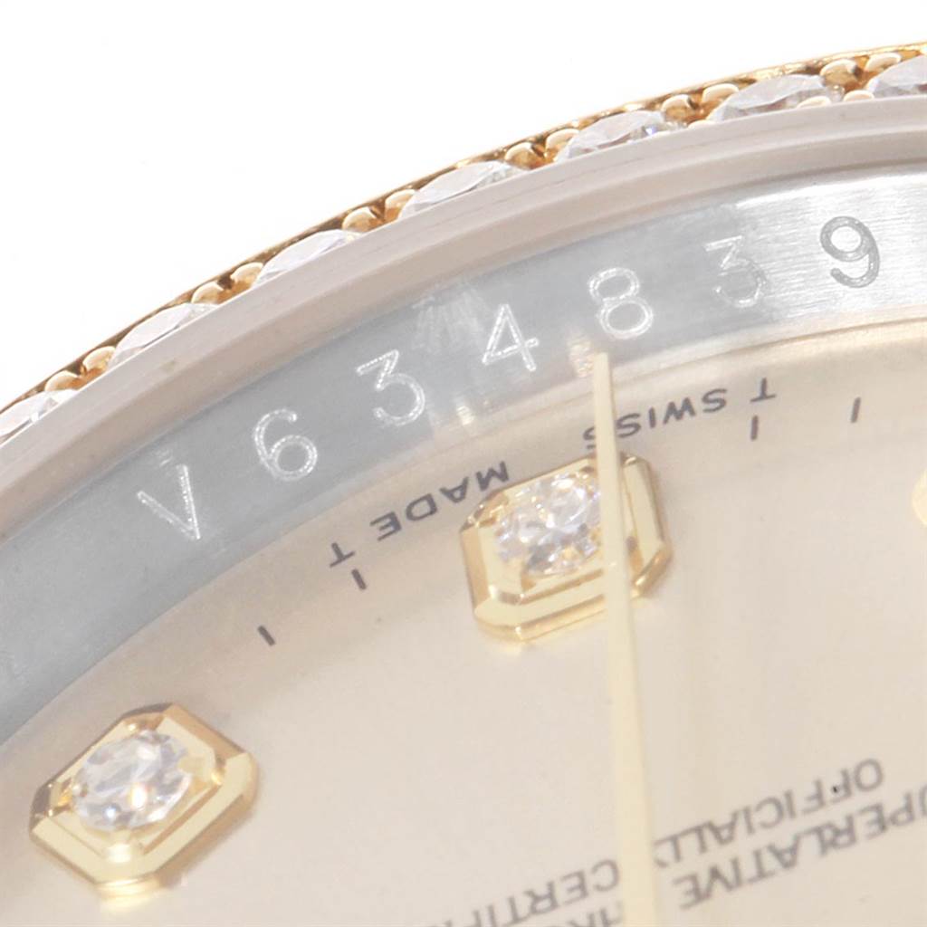 Close-up of a Rolex Datejust 116243 Men's Stainless Steel Silver Dial 116243 Men's Stainless Steel Silver Dial model showing part of the bezel, serial number, watch face, and diamond hour markers.