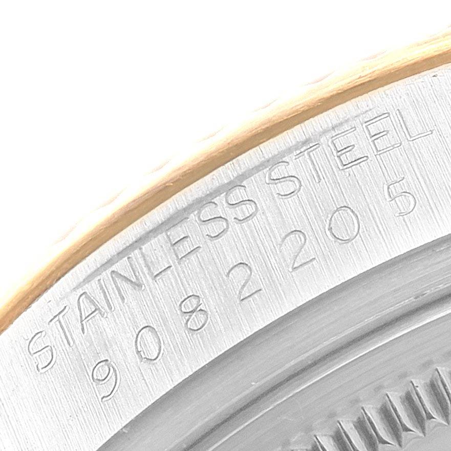 The image shows a macro view of the edge and serial number of a Rolex Datejust 16013 Men's Stainless Steel Champagne Dial 16013 Men's Stainless Steel Champagne Dial watch, focusing on the stainless steel engraving.