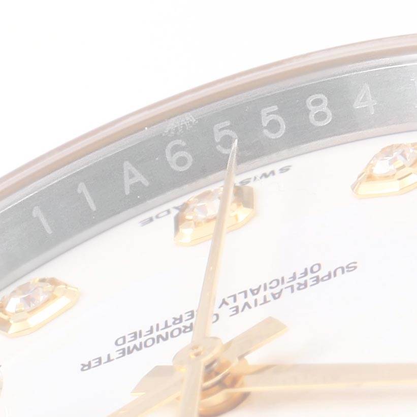 The image shows a close-up of a Rolex Datejust 116243 Men's Stainless Steel Silver Dial 116243 Men's Stainless Steel Silver Dial watch's dial, hands, and part of the rehaut with a serial number.