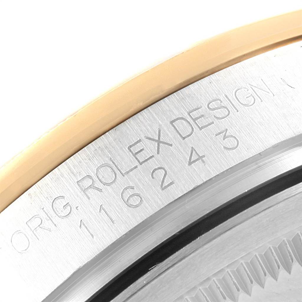This close-up image shows the engraved model number and bezel edge of a Rolex Datejust 116243 Men's Stainless Steel Silver Dial 116243 Men's Stainless Steel Silver Dial watch.