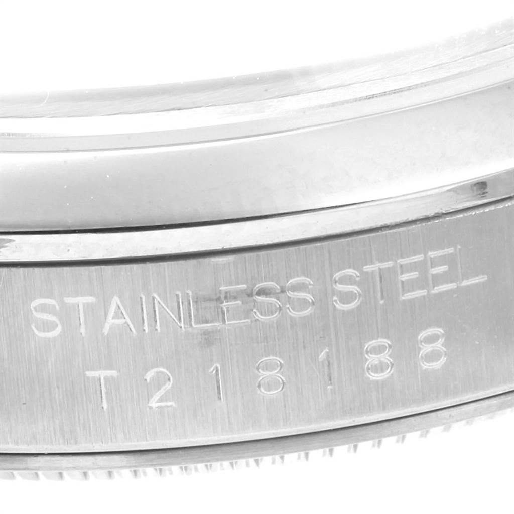 This image shows a close-up view of the steel casing of a Rolex Datejust 16200 Men's Stainless Steel Black Dial 16200 Men's Stainless Steel Black Dial watch, highlighting the stainless steel engraving and serial number.