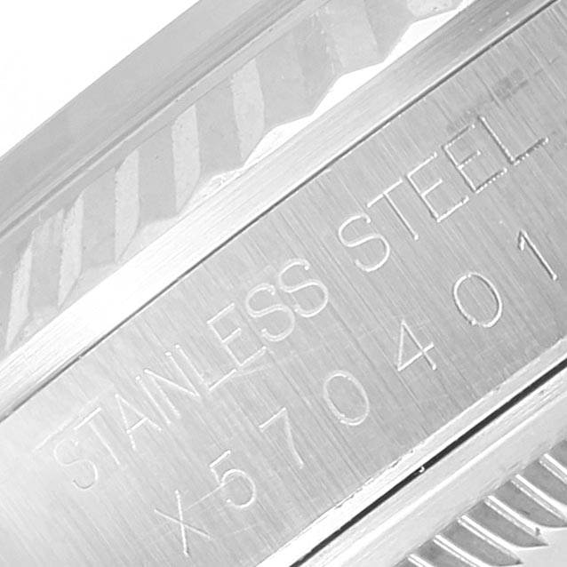 This is a close-up image of the side of a Rolex Datejust 16234 Men's Stainless Steel White Dial 16234 Men's Stainless Steel White Dial watch, showing its stainless steel material and serial number.